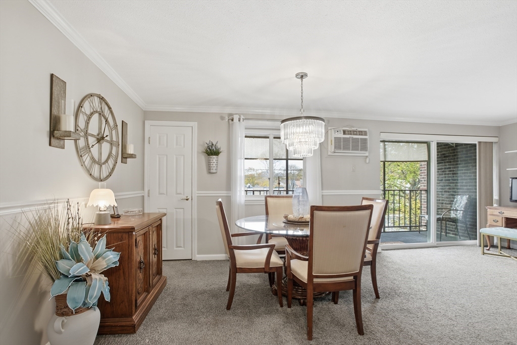 68 Main Street, Unit 36C Stoneham, MA 02180 - Photo 7 of 19 a view of a dining room with furniture window and outside view