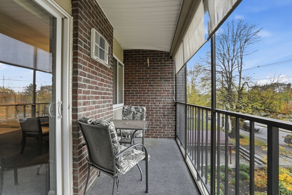 68 Main Street, Unit 36C Stoneham, MA 02180 - Photo 8 of 19 a view of a balcony with chairs