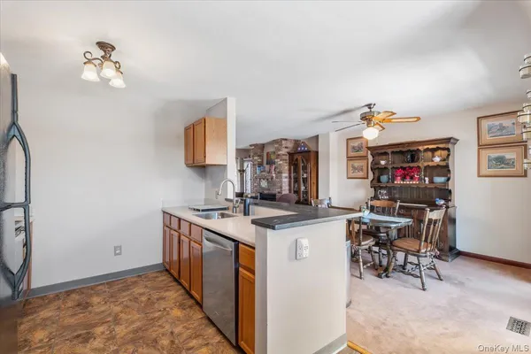 a kitchen with stainless steel appliances granite countertop a stove and a refrigerator