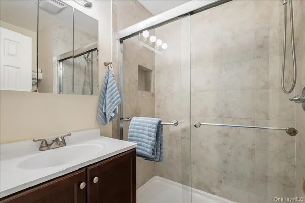 a bathroom with a sink and mirror
