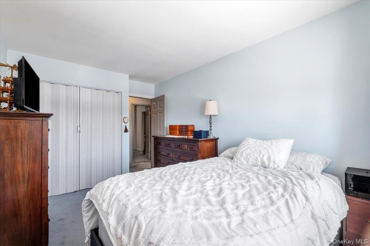 1707 Eagles Ridge Road Brewster, NY 10509 - Photo 26 of 50 a bedroom with a bed and a flat screen tv