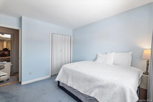 a room with a bed and a view of bedroom