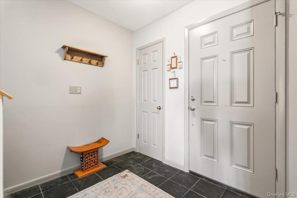 1707 Eagles Ridge Road Brewster, NY 10509 - Photo 37 of 50 a door with a bench