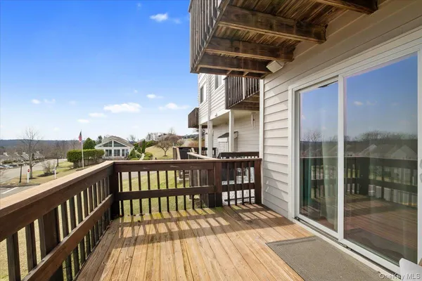 a view of a balcony with wooden floor