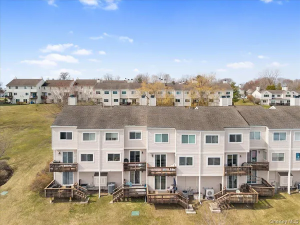 a view of a lake with building in front of it