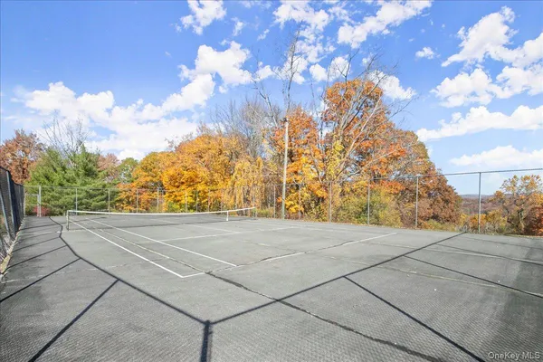 a view of an outdoor space with wooden fence