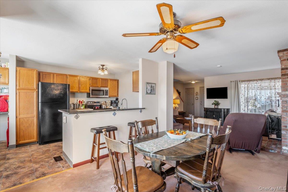 1707 Eagles Ridge Road Brewster, NY 10509 - Photo 9 of 50 a view of a dining room with furniture window and wooden floor