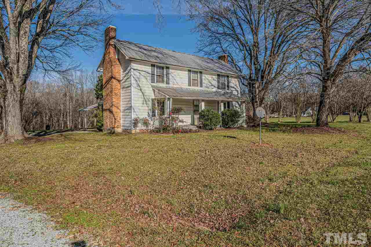 420 County Line Road Timberlake, NC 27583 - Photo 2 of 30 a front view of residential houses with yard and trees