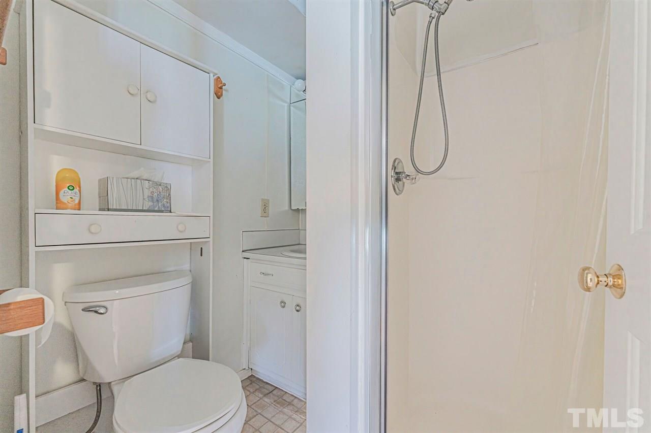420 County Line Road Timberlake, NC 27583 - Photo 11 of 30 a bathroom with a toilet and a shower