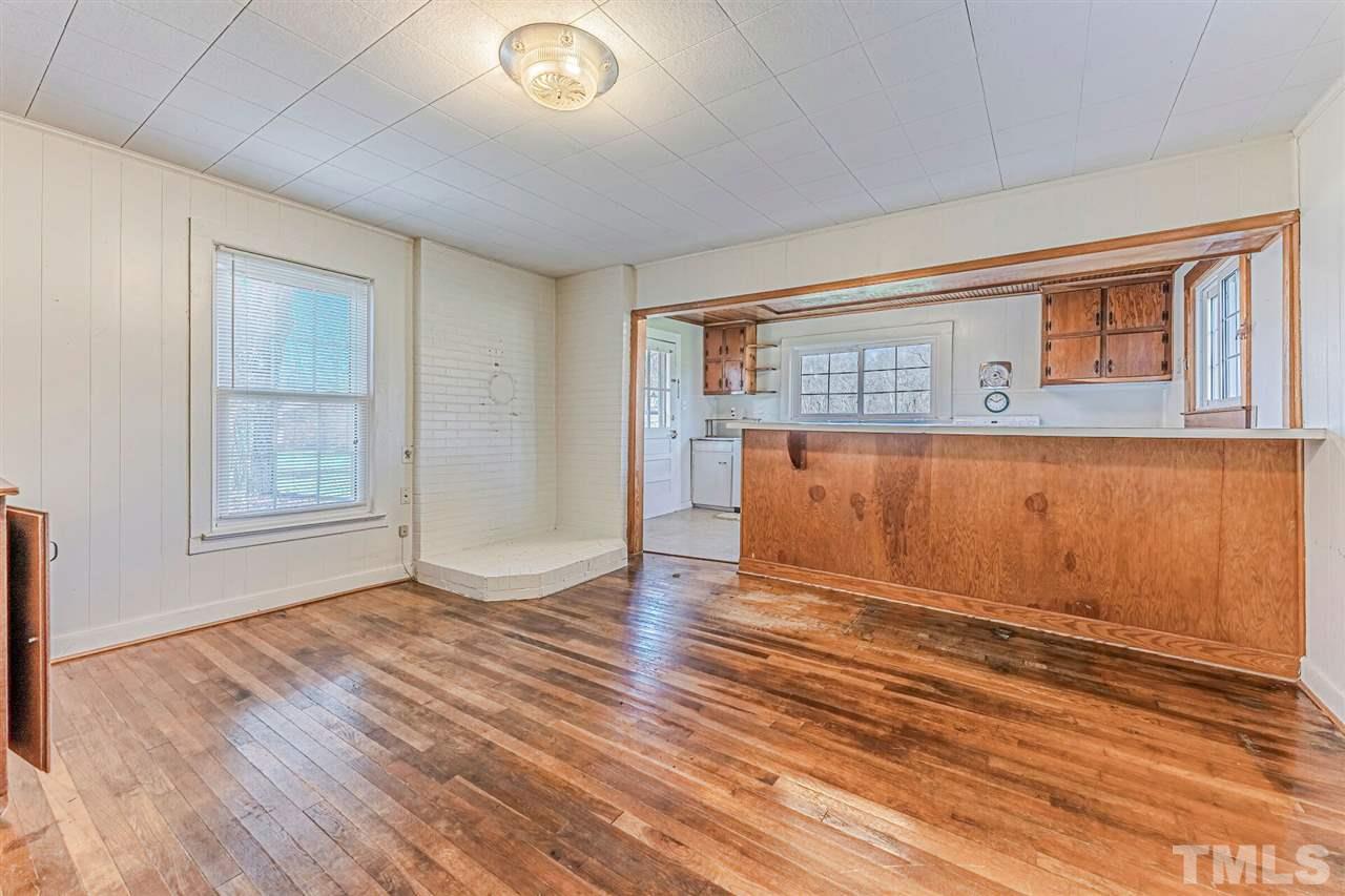 420 County Line Road Timberlake, NC 27583 - Photo 13 of 30 an empty room with wooden floor and windows