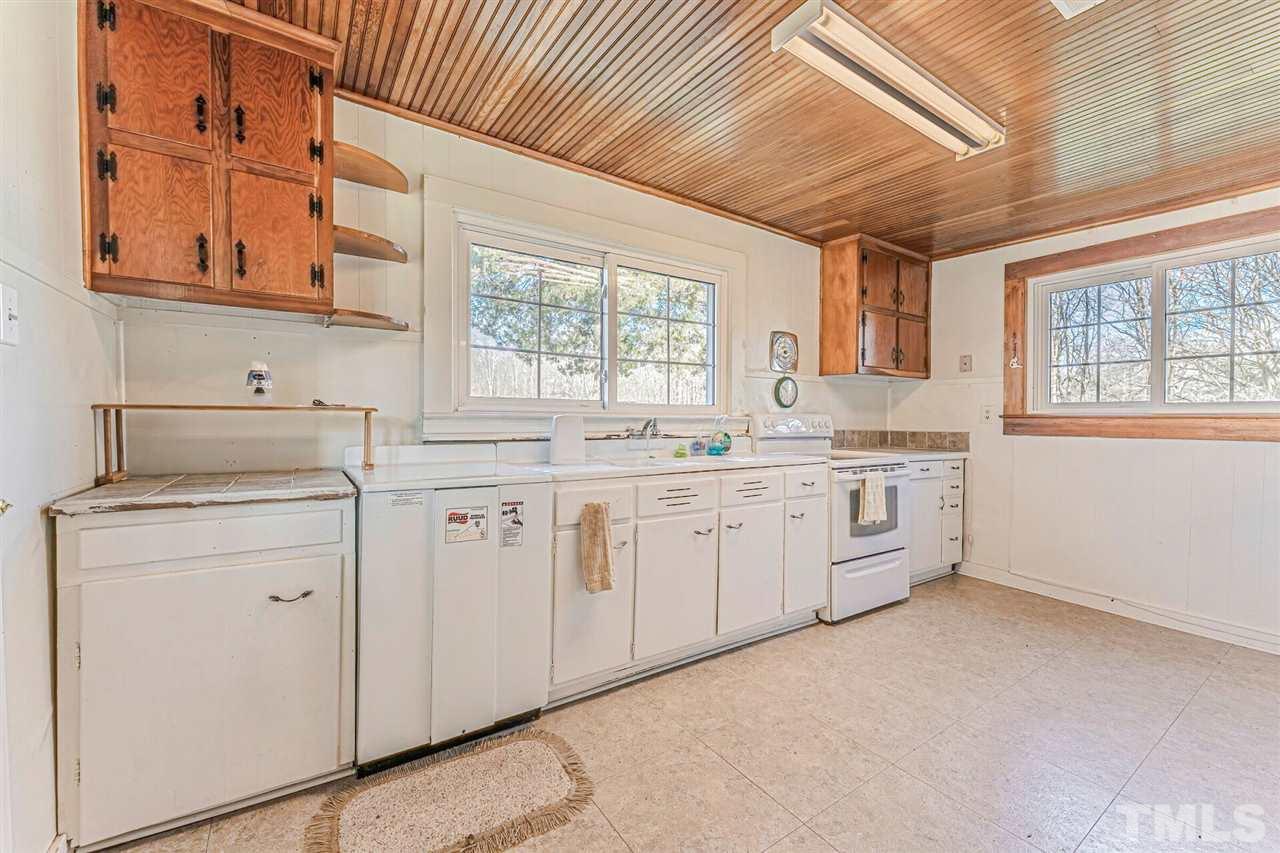 420 County Line Road Timberlake, NC 27583 - Photo 18 of 30 a kitchen with cabinets appliances a sink and a window