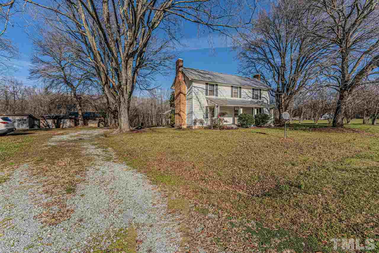 420 County Line Road Timberlake, NC 27583 - Photo 26 of 30 a view of a yard with a large tree