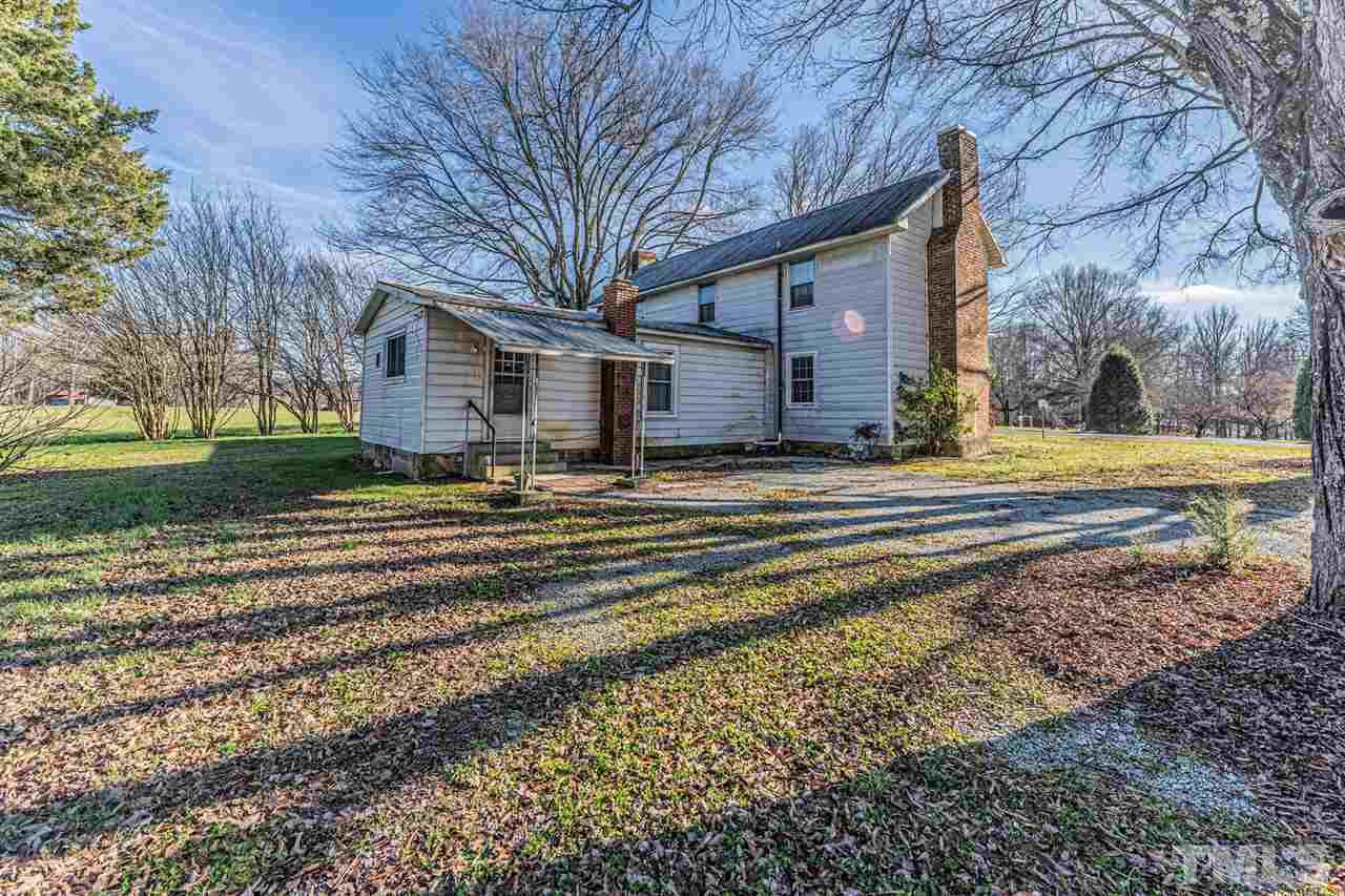 420 County Line Road Timberlake, NC 27583 - Photo 29 of 30 a view of a house with a yard and large trees