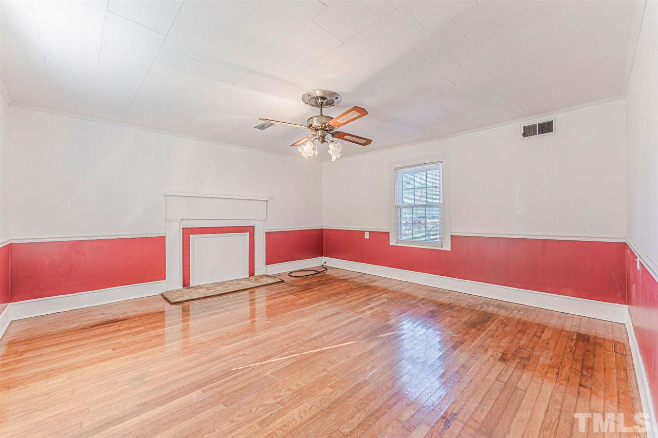 420 County Line Road Timberlake, NC 27583 - Photo 5 of 30 a view of empty room with wooden floor and fan
