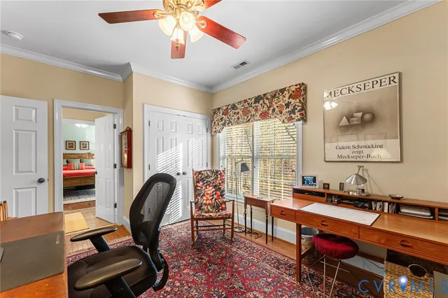 a bedroom with a bed furniture and a large window