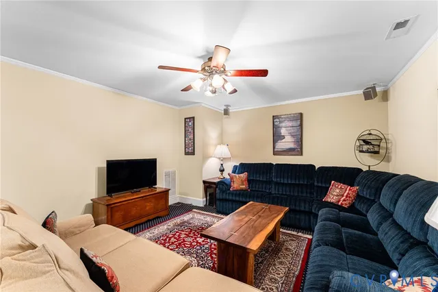 a living room with furniture rug and window