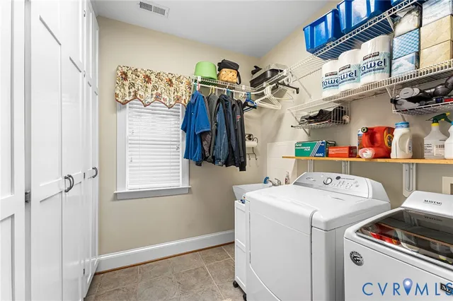 a living room with furniture gym equipment and a flat screen tv