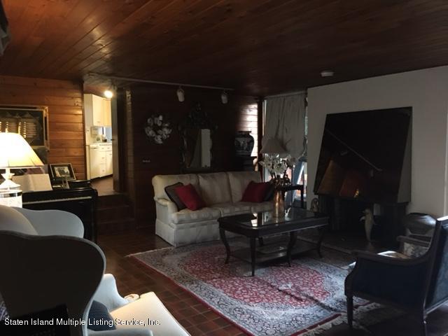 775 Todt Hill Road Staten Island, NY 10304 - Photo 3 of 4 a living room with furniture and wooden floor
