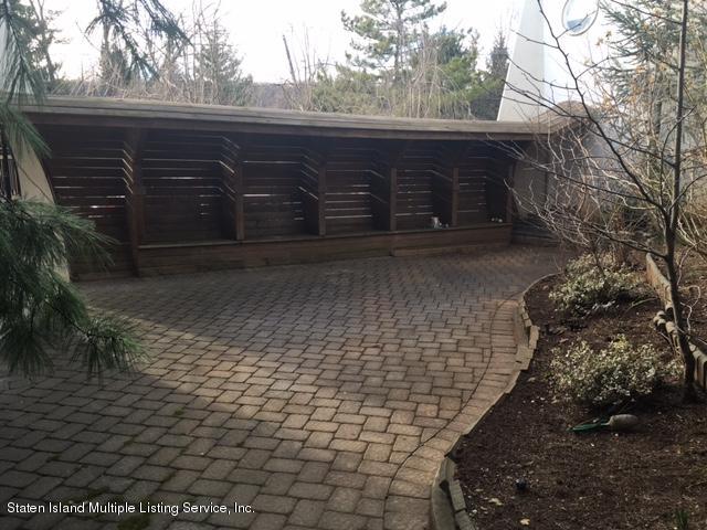 775 Todt Hill Road Staten Island, NY 10304 - Photo 4 of 4 a view of a backyard of the house