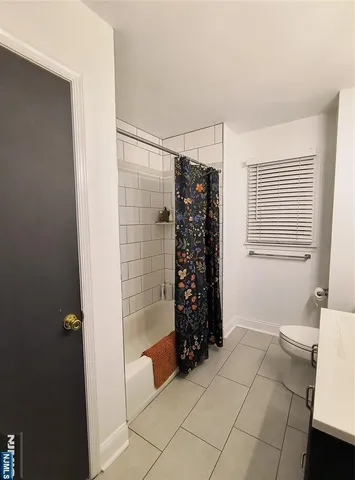 a view of walk in closet with window