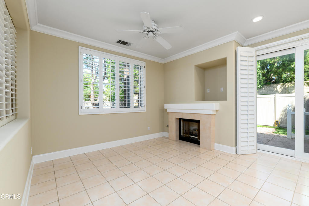 353 Via Cantilena Camarillo, CA 93012 - Photo 11 of 42 an empty room with windows and fireplace