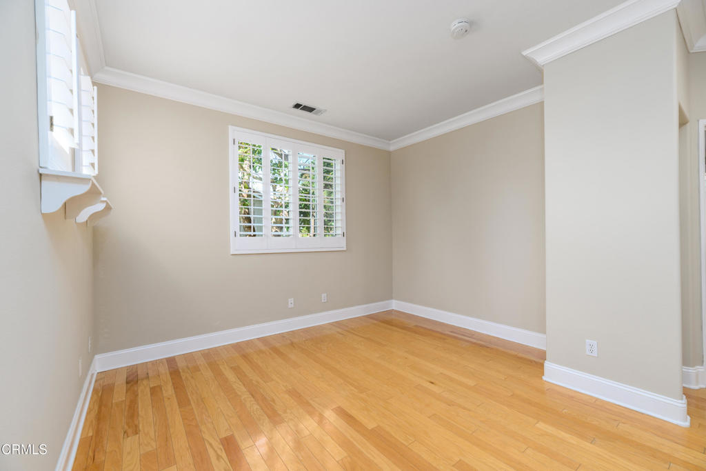353 Via Cantilena Camarillo, CA 93012 - Photo 20 of 42 a view of an empty room with wooden floor and a window