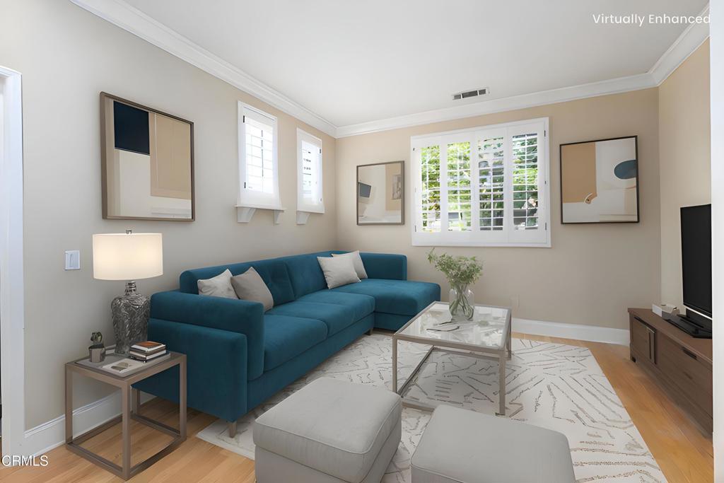 353 Via Cantilena Camarillo, CA 93012 - Photo 21 of 42 a living room with furniture a flat screen tv and a window