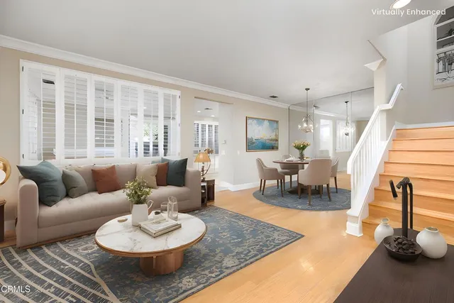 a living room with furniture and a table