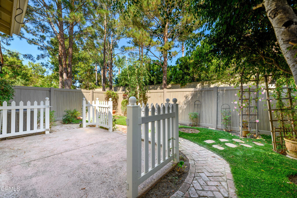 353 Via Cantilena Camarillo, CA 93012 - Photo 38 of 42 a view of a house with a small yard and wooden fence