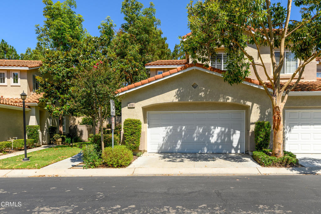 353 Via Cantilena Camarillo, CA 93012 - Photo 41 of 42 a front view of a house with a yard and garage