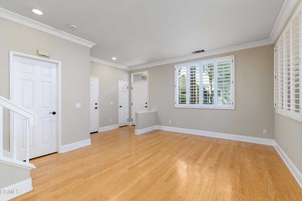 353 Via Cantilena Camarillo, CA 93012 - Photo 6 of 42 a view of an empty room with wooden floor and a window