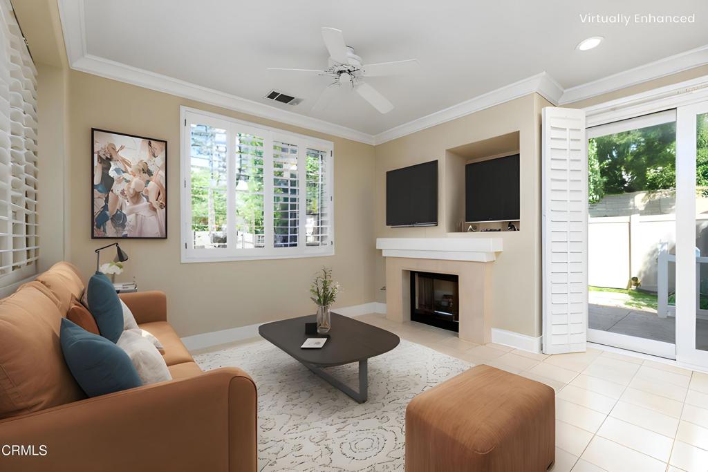 353 Via Cantilena Camarillo, CA 93012 - Photo 10 of 42 a living room with furniture a fireplace and a flat screen tv