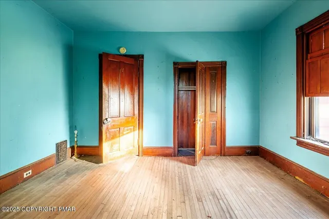 a bedroom with window and natural light