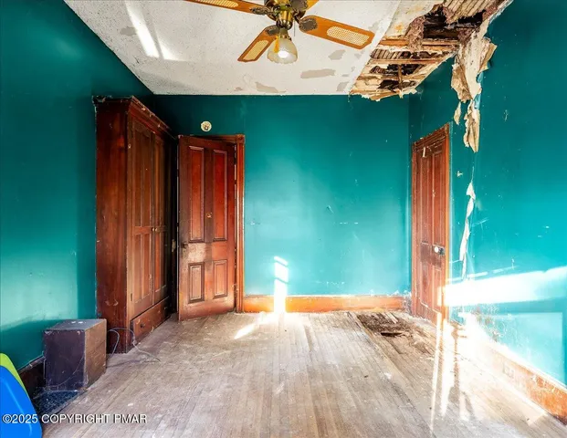 a bathroom with a granite countertop sink toilet and a mirror