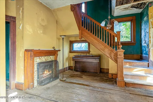 a view of an entryway with fireplace
