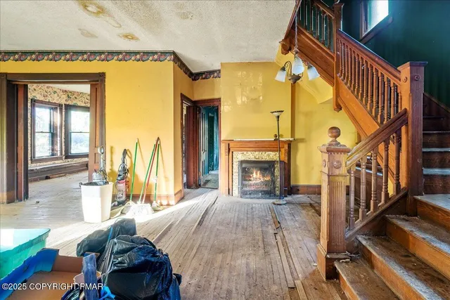 a view of a livingroom with furniture and a fireplace