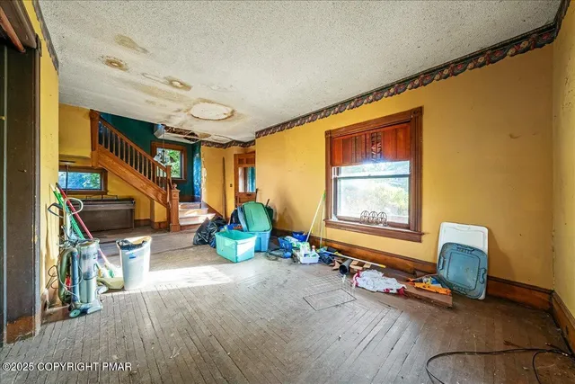 a view of room with furniture and windows