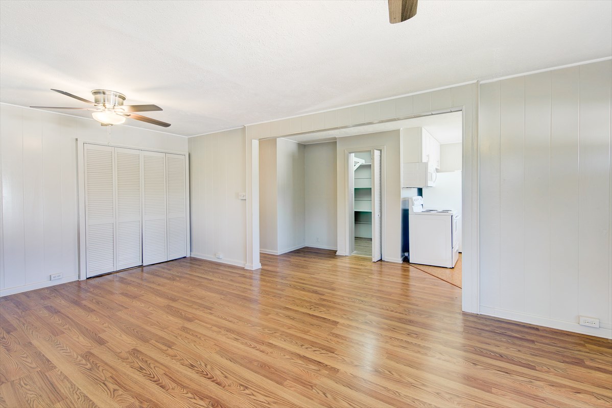 8562 Elepaio Road Kekaha, HI 96752 - Photo 8 of 21 a view of an empty room with wooden floor