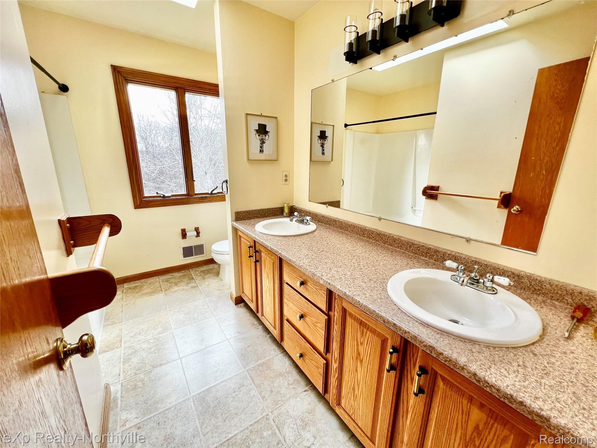 6573 Pinckney Road Pinckney, MI 48169 - Photo 11 of 20 Upstairs Bathroom - Vanity