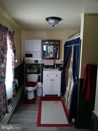 a room with furniture a rug and a flat screen tv