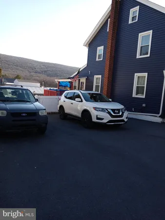 a car parked in front of a house