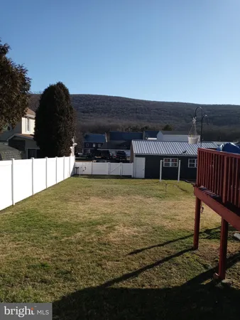 a view of a swimming pool with an outdoor seating