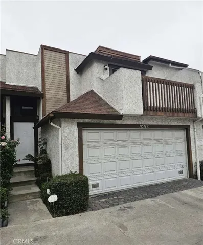 a front view of a house with garage