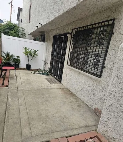 a kitchen with kitchen island a sink stainless steel appliances and a chandelier