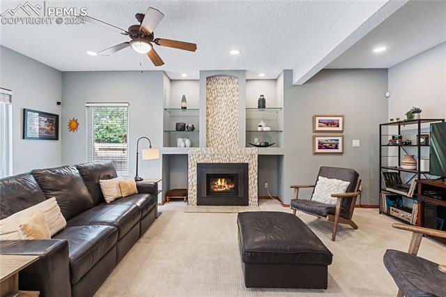 7510 Julynn Road Colorado Springs, CO 80919 - Photo 11 of 36 Upgraded carpet and a ceiling fan add to the comfort and functionality of this space