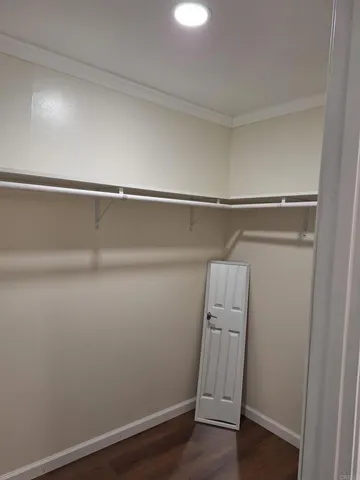 a view of an empty walk in closet