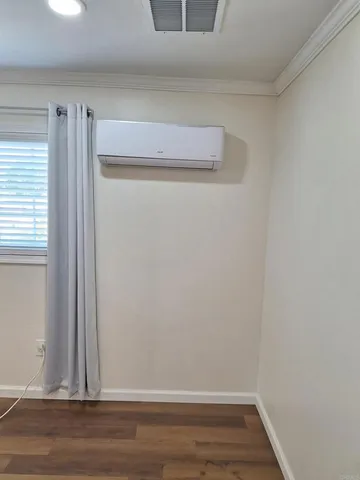 a view of small space with wooden floor