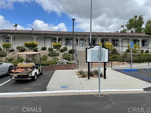 a view of a car park in front of house