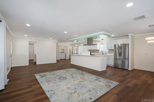 a view of kitchen with wooden floor