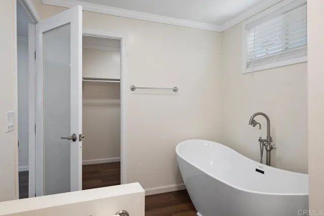 a bathroom with a bathtub and shower